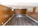 Spacious basement with durable laminate flooring and painted walls at 601 Carole Ln, Charlotte, NC 28214