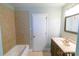 Bathroom showcasing tile and tub, complemented by a vanity at 601 Carole Ln, Charlotte, NC 28214