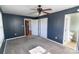 Bedroom featuring neutral carpet, closet, ceiling fan and natural light at 601 Carole Ln, Charlotte, NC 28214