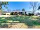 Classic single-story brick home showcasing a spacious front yard and tidy landscaping at 601 Carole Ln, Charlotte, NC 28214
