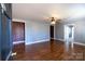 Inviting living room boasts gleaming hardwood floors, ceiling fan, and neutral paint at 601 Carole Ln, Charlotte, NC 28214