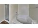 Bathroom featuring modern soaking tub and glass-door shower at 620 Weyburn Nw Dr, Concord, NC 28027