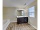 Bright bathroom featuring double sink vanity, soaking tub, and window with natural light at 620 Weyburn Nw Dr, Concord, NC 28027