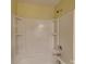 Bathroom featuring shower and tub combo with neutral tile at 620 Weyburn Nw Dr, Concord, NC 28027