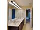 Bathroom showcasing a large double vanity with modern lighting and mirrors at 620 Weyburn Nw Dr, Concord, NC 28027