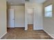 Bedroom featuring carpet, window, and closet at 620 Weyburn Nw Dr, Concord, NC 28027