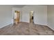 Spacious bedroom with neutral carpet and access to ensuite bathroom at 620 Weyburn Nw Dr, Concord, NC 28027