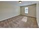Neutral bedroom with cozy carpet, window, and ample space at 620 Weyburn Nw Dr, Concord, NC 28027