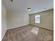 Neutral bedroom with cozy carpet, window, and ample space at 620 Weyburn Nw Dr, Concord, NC 28027