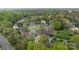 An aerial view of a suburban neighborhood nestled among lush green trees and well-maintained lawns at 6319 High Creek Ct, Charlotte, NC 28277