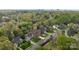 An aerial view of suburban homes surrounded by lush green trees in a well-maintained neighborhood at 6319 High Creek Ct, Charlotte, NC 28277