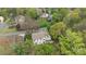 An aerial view showcasing the backyard and nearby lush green surroundings of a white residential home at 6319 High Creek Ct, Charlotte, NC 28277