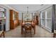 Elegant dining room featuring wood furniture, decorative lighting, and natural light at 6319 High Creek Ct, Charlotte, NC 28277