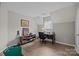 Home office features a desk, shelves, and a putting green for leisure at 6319 High Creek Ct, Charlotte, NC 28277