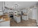 Spacious kitchen featuring a center island, stainless steel appliances, and granite countertops at 6319 High Creek Ct, Charlotte, NC 28277