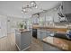 Bright eat-in kitchen featuring a center island, stainless steel appliances, and granite countertops at 6319 High Creek Ct, Charlotte, NC 28277
