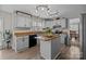 Eat-in kitchen featuring a center island, stainless steel appliances, and granite countertops at 6319 High Creek Ct, Charlotte, NC 28277
