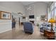 Spacious living room featuring a fireplace, large windows, and comfortable seating at 6319 High Creek Ct, Charlotte, NC 28277