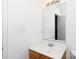 Well-lit bathroom featuring a wood vanity, white countertop, and a large mirror at 639 Fawnborough Ct, Rock Hill, SC 29732