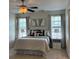 Inviting bedroom with soft lighting, a comfortable bed, and stylish decor at 6410 Hasley Woods Dr, Huntersville, NC 28078