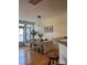 Bright dining room with a table setting, modern pendant lighting, and hardwood floors at 6410 Hasley Woods Dr, Huntersville, NC 28078