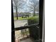 View of the neighborhood street and gazebo through a window with black frame at 6410 Hasley Woods Dr, Huntersville, NC 28078