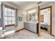 Bathroom featuring a double sink vanity, tile flooring, and a window at 6688 Pine Forest Dr, York, SC 29745