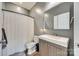 Compact bathroom features a sleek vanity, modern toilet, and shower with a curtain at 6688 Pine Forest Dr, York, SC 29745