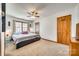 Cozy bedroom with carpet, ceiling fan, large window, and closet space at 6688 Pine Forest Dr, York, SC 29745