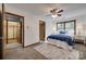 This bedroom features a ceiling fan, a window, and a patterned rug at 6688 Pine Forest Dr, York, SC 29745