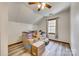 This bedroom is currently staged with packed boxes but boasts a ceiling fan at 6688 Pine Forest Dr, York, SC 29745