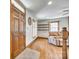 Inviting entryway with a wood door, hardwood floors, and views of the open-concept living area at 6688 Pine Forest Dr, York, SC 29745
