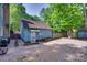 Detached garage with gravel driveway and fenced yard, providing ample space and privacy at 6688 Pine Forest Dr, York, SC 29745