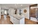 Kitchen island with stone countertop and hardwood floors at 6688 Pine Forest Dr, York, SC 29745