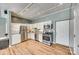 Functional kitchen featuring stainless steel appliances, white cabinetry, and a convenient washer/dryer unit at 6688 Pine Forest Dr, York, SC 29745