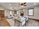 Inviting living room with hardwood floors, a white brick fireplace, and ample natural light at 6688 Pine Forest Dr, York, SC 29745