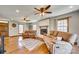 Inviting living room with hardwood floors, brick fireplace, ceiling fans, and comfortable seating at 6688 Pine Forest Dr, York, SC 29745