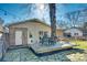 Backyard patio area with outdoor dining set, string lights, and manicured lawn at 6956 Oakstone Pl, Charlotte, NC 28210