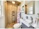 Unique bathroom featuring tiled walls, modern fixtures, and a walk-in shower at 6956 Oakstone Pl, Charlotte, NC 28210