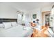 Comfortable bedroom with hardwood floors and natural light has a work space to the side at 6956 Oakstone Pl, Charlotte, NC 28210