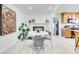 Dining area with modern decor, fireplace, and decorative plants at 6956 Oakstone Pl, Charlotte, NC 28210