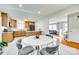 Open dining and kitchen area featuring modern finishes and bright lighting at 6956 Oakstone Pl, Charlotte, NC 28210