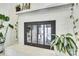 Close-up of a brick fireplace with decorative plants, adding a cozy ambiance at 6956 Oakstone Pl, Charlotte, NC 28210
