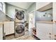 Practical laundry space has lots of storage and modern appliances at 6956 Oakstone Pl, Charlotte, NC 28210