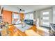 Bright living room with hardwood floors, comfortable seating, and natural light at 6956 Oakstone Pl, Charlotte, NC 28210