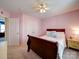 Bedroom featuring carpet, a ceiling fan, and neutral-colored curtains at 7120 Furlow Ln, Harrisburg, NC 28075