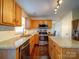 Well-lit kitchen featuring granite counters, wood cabinets, stainless steel appliances, and a central island at 7120 Furlow Ln, Harrisburg, NC 28075