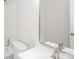 This bathroom features a white sink vanity, toilet, bathtub, and a large frameless mirror at 7124 Brynhurst Dr, Charlotte, NC 28210