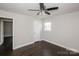 Serene bedroom with dark wood floors and natural light window at 7124 Brynhurst Dr, Charlotte, NC 28210