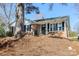 Brick house with black shutters, well maintained landscaping at 7124 Brynhurst Dr, Charlotte, NC 28210